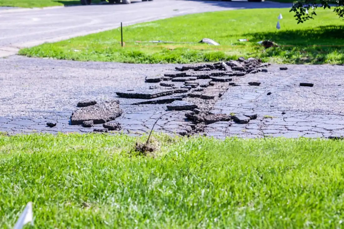 Sunken asphalt driveway section about to be patched in Knoxville TN